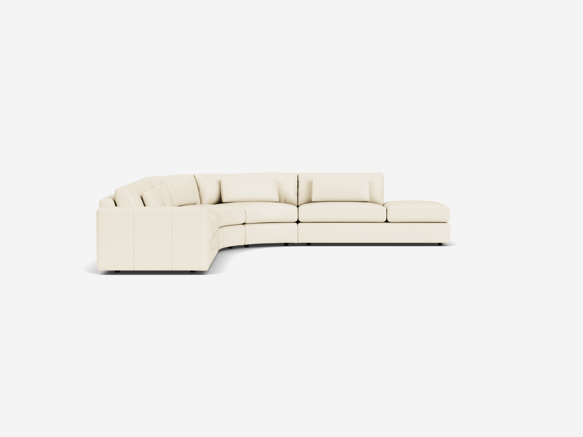 Left side view of white curved leather sectional sofa with right hand chaise